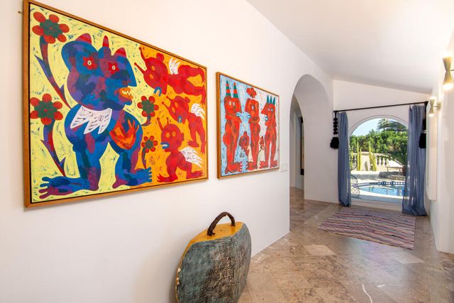 a bedroom with a bed and a chair