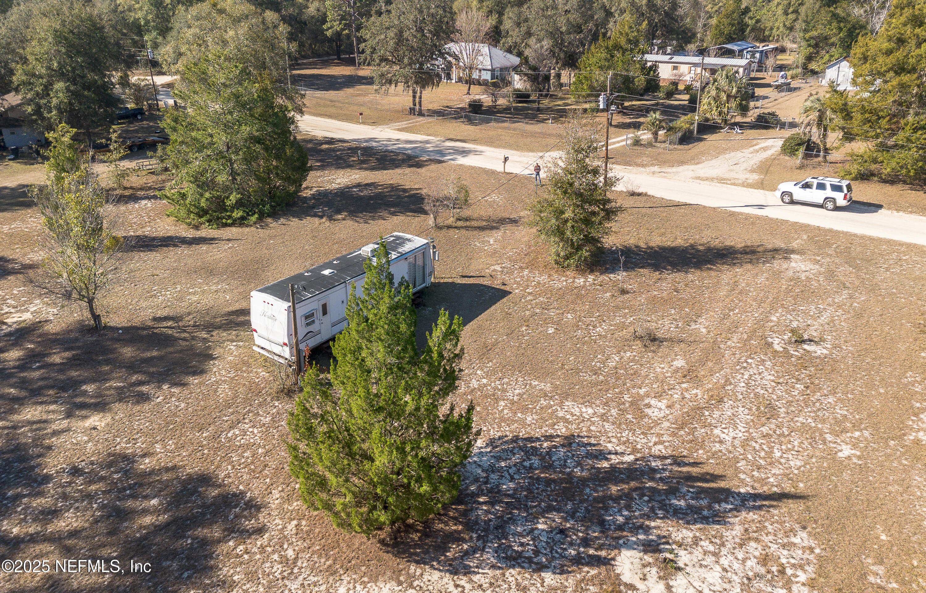 124 Shiloh Road Melrose, FL 32666 - Photo 4 of 10 a view of a yard with plants and trees