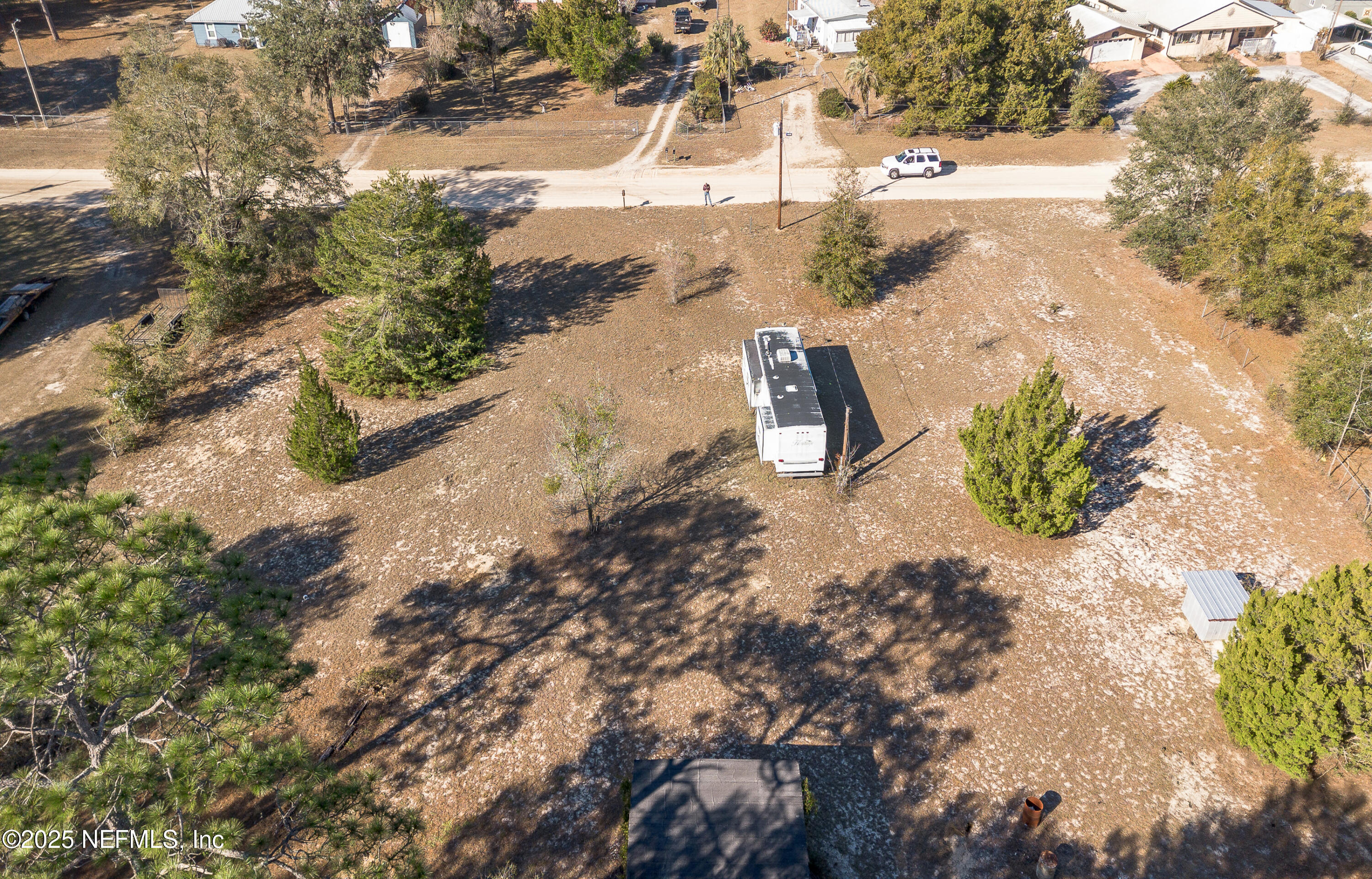 124 Shiloh Road Melrose, FL 32666 - Photo 8 of 10 a view of a yard with wooden fence