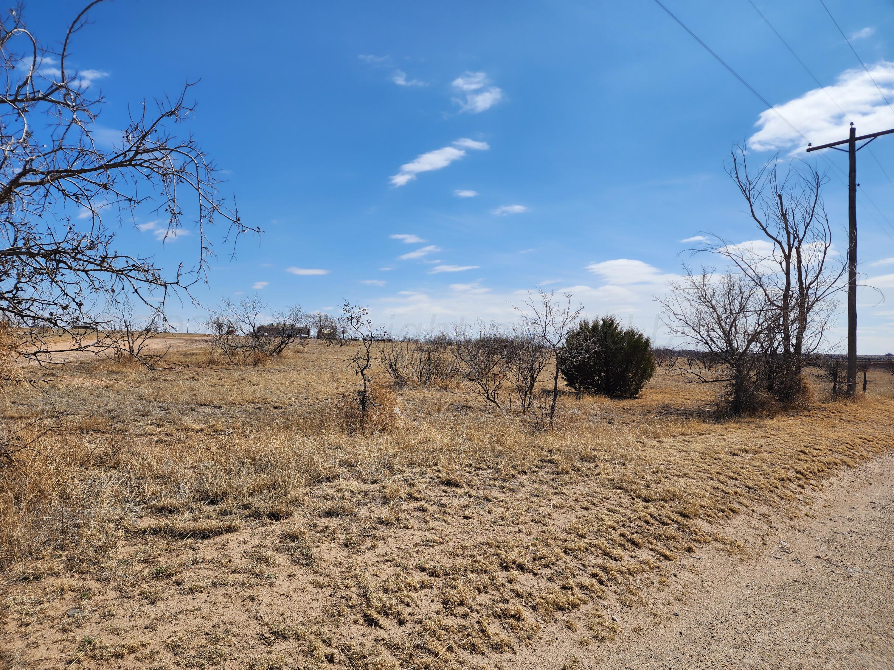 400 East Plantation Road Amarillo, TX 79118 - Photo 3 of 6 a view of a dry yard with wooden fence