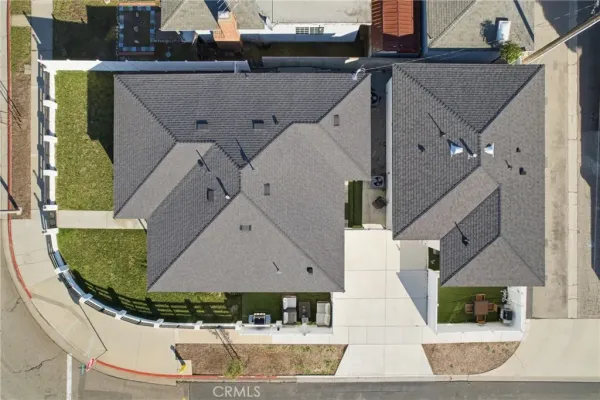 an aerial view of a house with a swimming pool