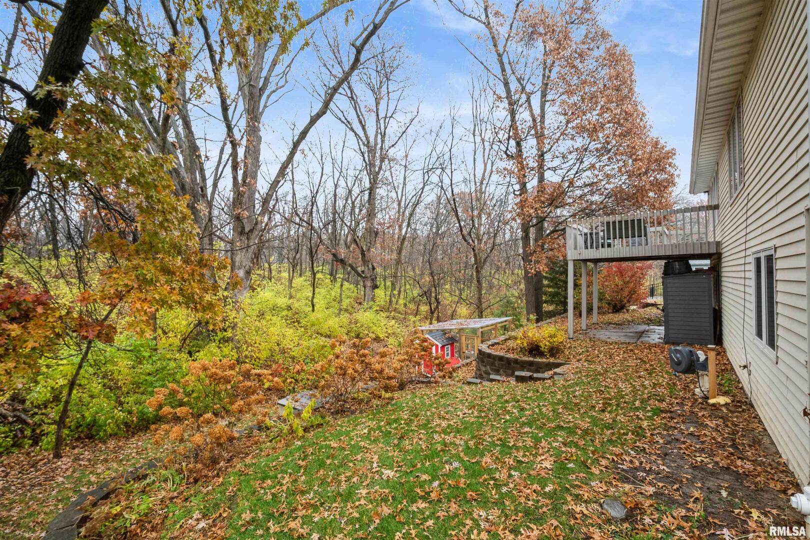 1205 28th Avenue Silvis, IL 61282 - Photo 23 of 24 a backyard of a house with barbeque oven table and chairs