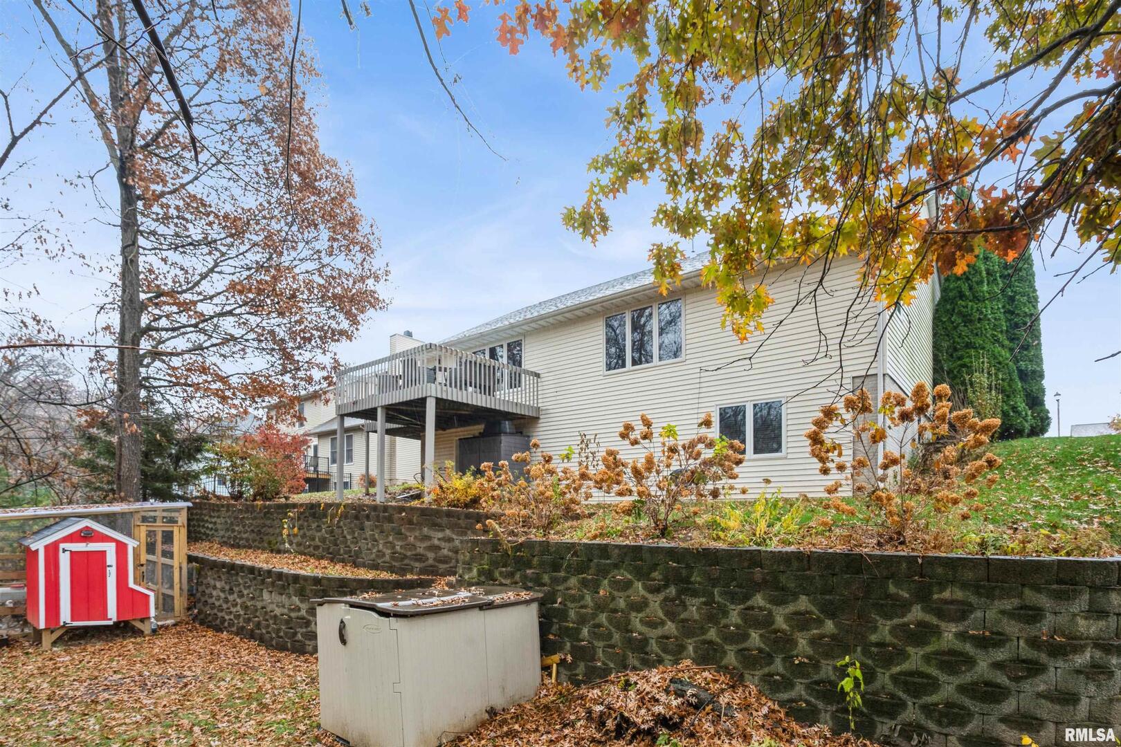 1205 28th Avenue Silvis, IL 61282 - Photo 24 of 24 a front view of a house with lots of trees