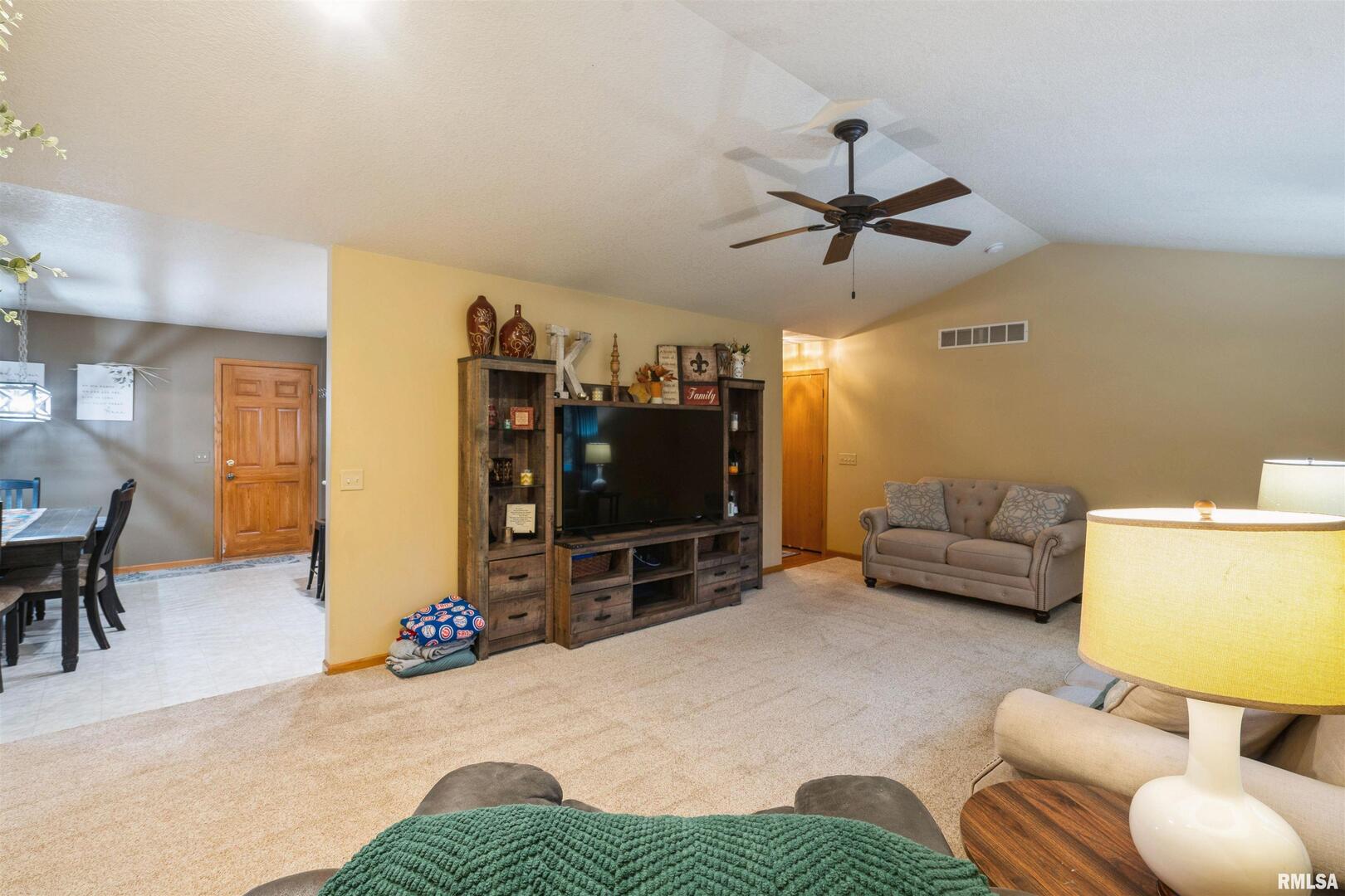 1205 28th Avenue Silvis, IL 61282 - Photo 6 of 24 a living room with furniture and a flat screen tv