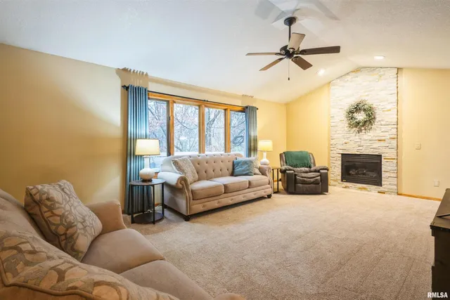 a living room with furniture fireplace and a flat screen tv