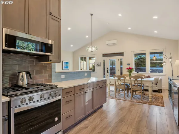 a kitchen with stainless steel appliances a refrigerator and a sink
