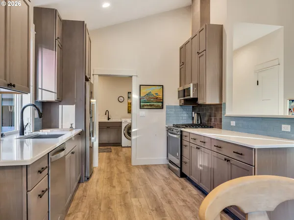 a bedroom with a bed and a refrigerator