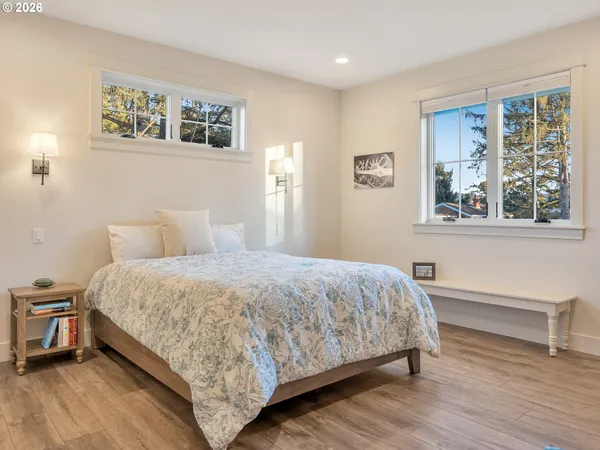 a bedroom with a bed and a table