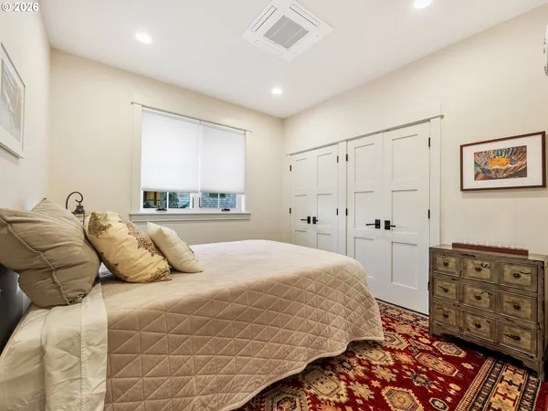 a bathroom with a double vanity sink toilet and shower