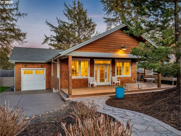 a front view of house with outdoor seating
