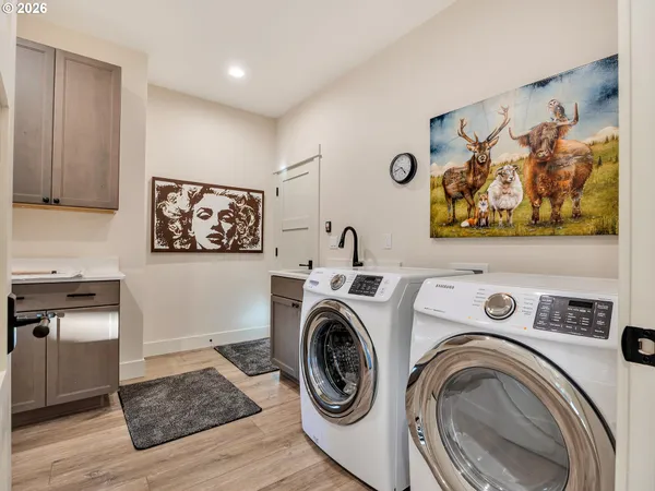 a bedroom with furniture and a flat screen tv