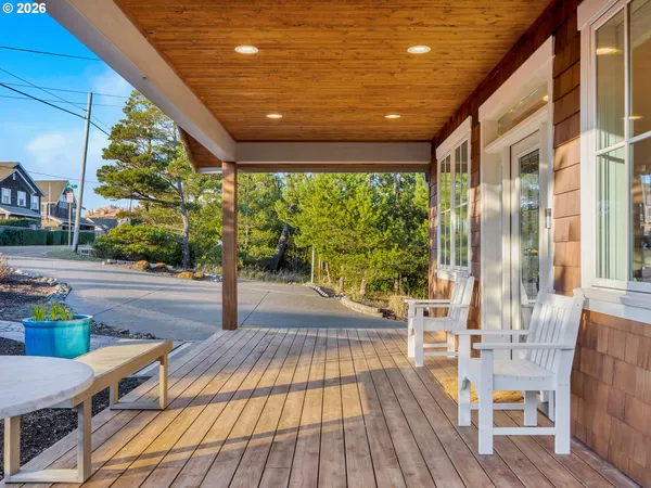 a view of a patio with wooden floor
