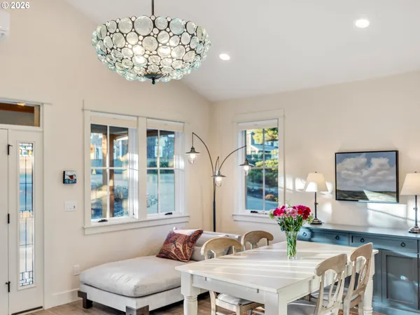 a living room with furniture kitchen view and a fireplace