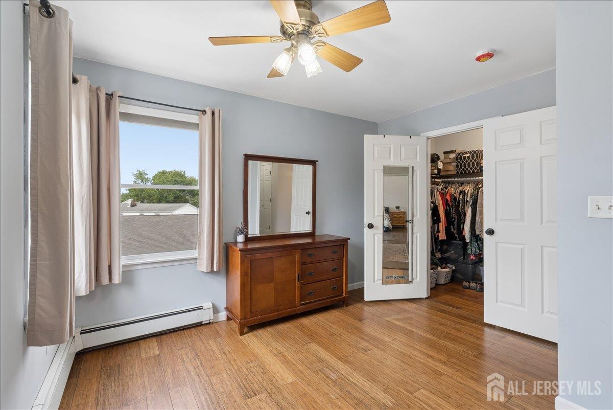 45 Walnut Street Edison, NJ 08817 - Photo 11 of 28 a view of an entryway with wooden floor and a ceiling fan