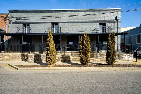 a view of a building with the street
