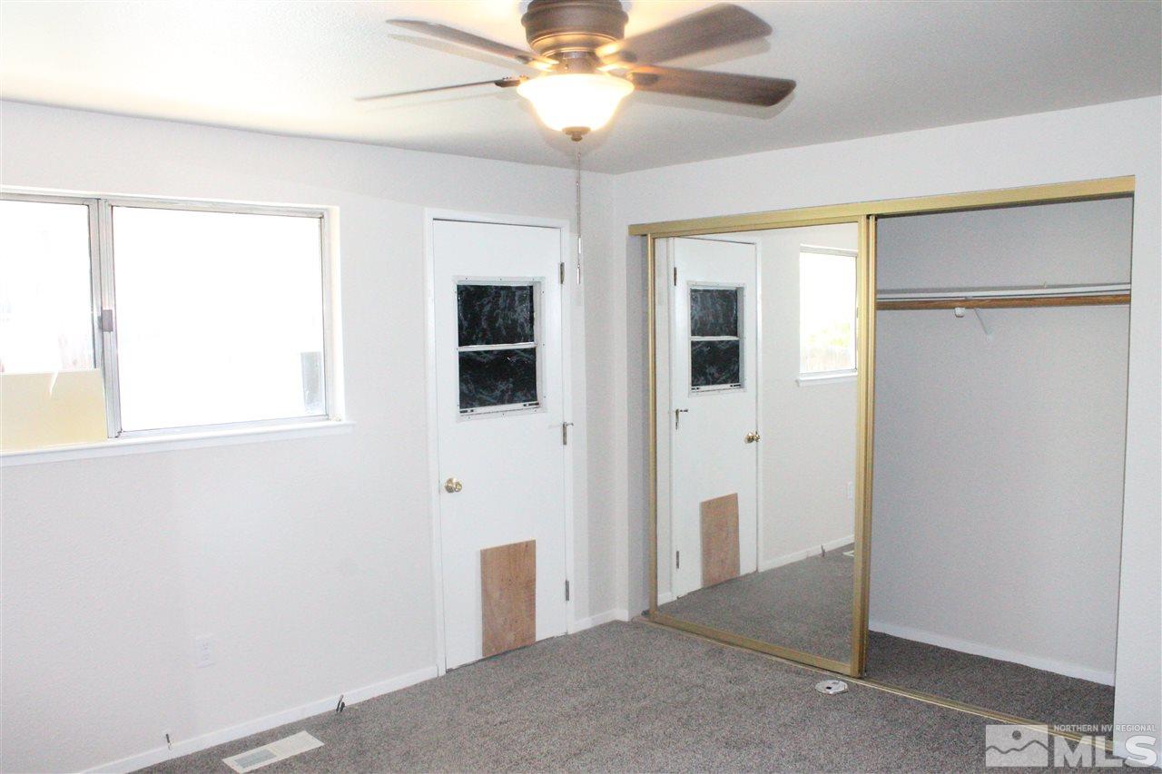 6630 Lotus Street Reno, NV 89506 - Photo 19 of 21 a view of a big room with windows and chandelier fan