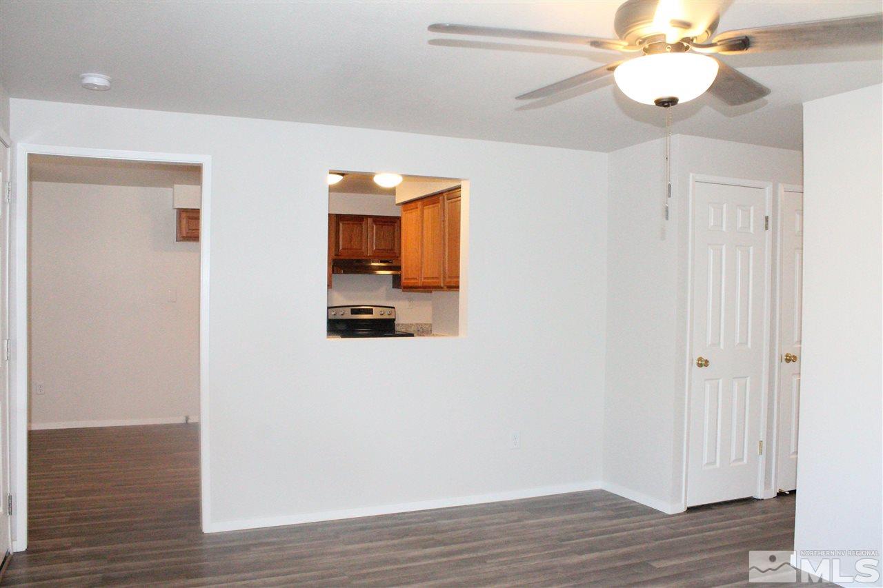 6630 Lotus Street Reno, NV 89506 - Photo 4 of 21 a view of a hallway with wooden floor