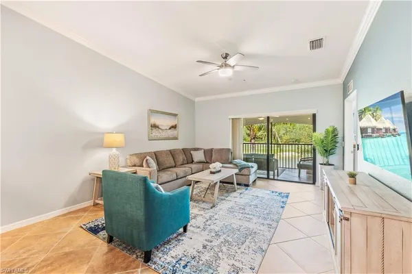 a living room with furniture and a large window