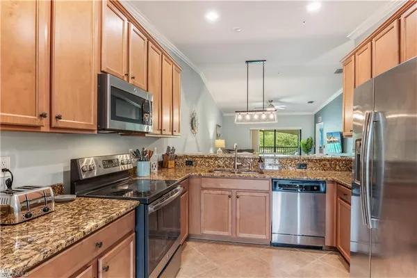 a kitchen with a sink stove and cabinets