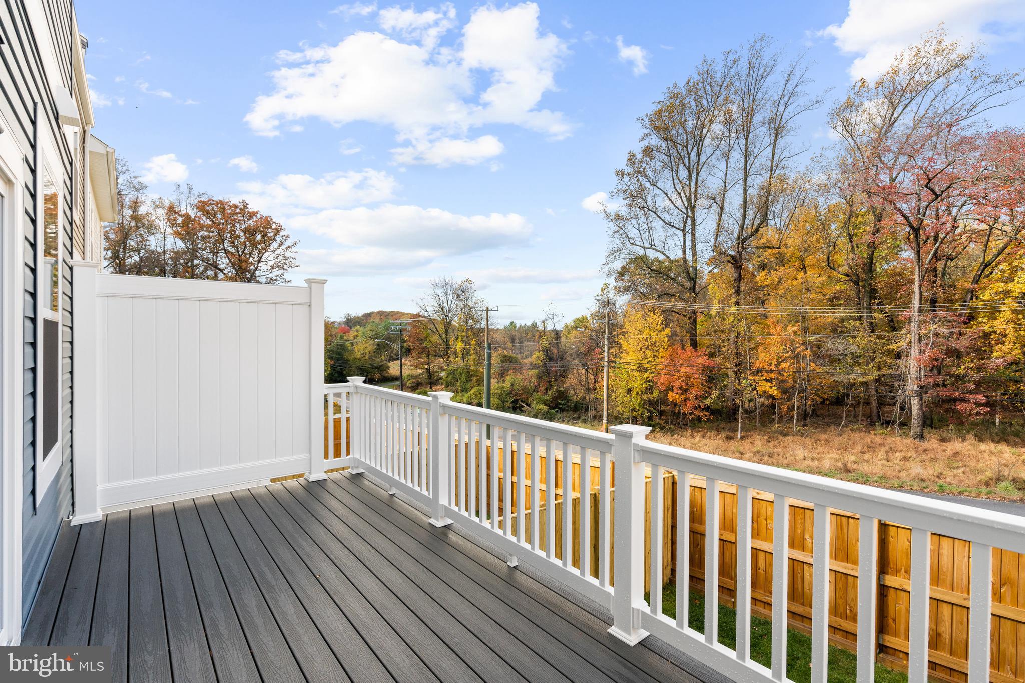 1749 Water Xing Road Baltimore, MD 21208 - Photo 2 of 2 a view of a balcony with wooden floor and fence