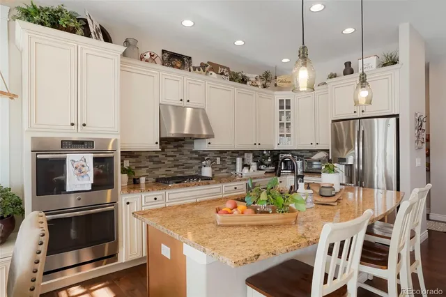 a en suite bathroom with double sink and a large mirror