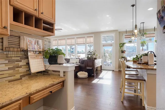 a very nice looking room with a large window and a potted plant