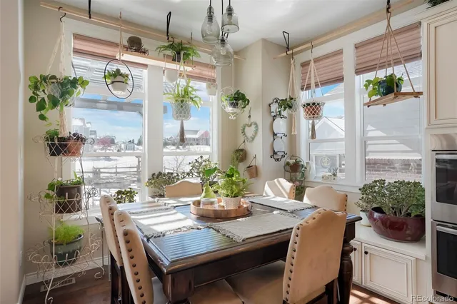 a bedroom with a bed couch and a large window