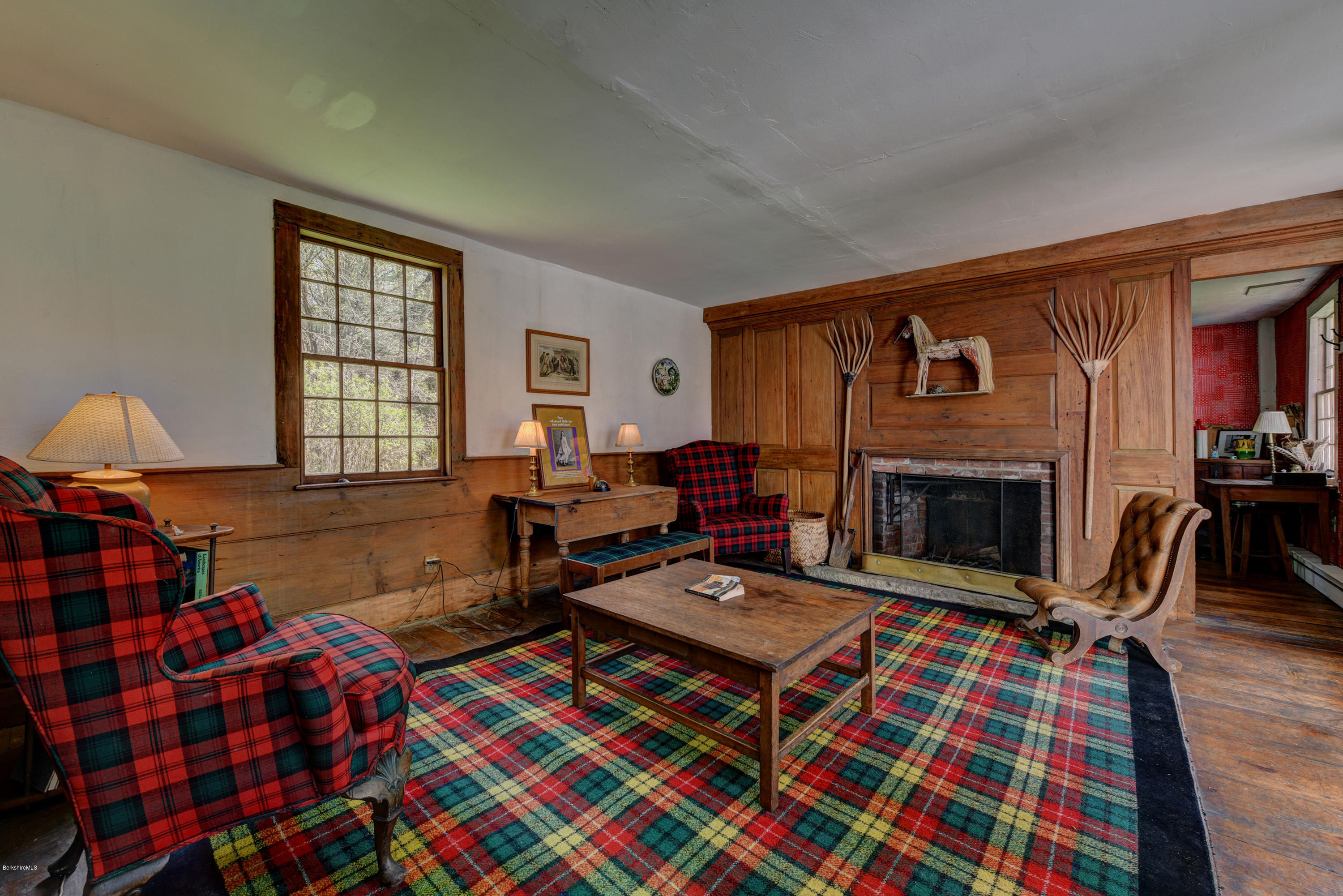 82 Hammertown Road Sandisfield, MA 01255 - Photo 12 of 49 a living room with furniture and a fireplace