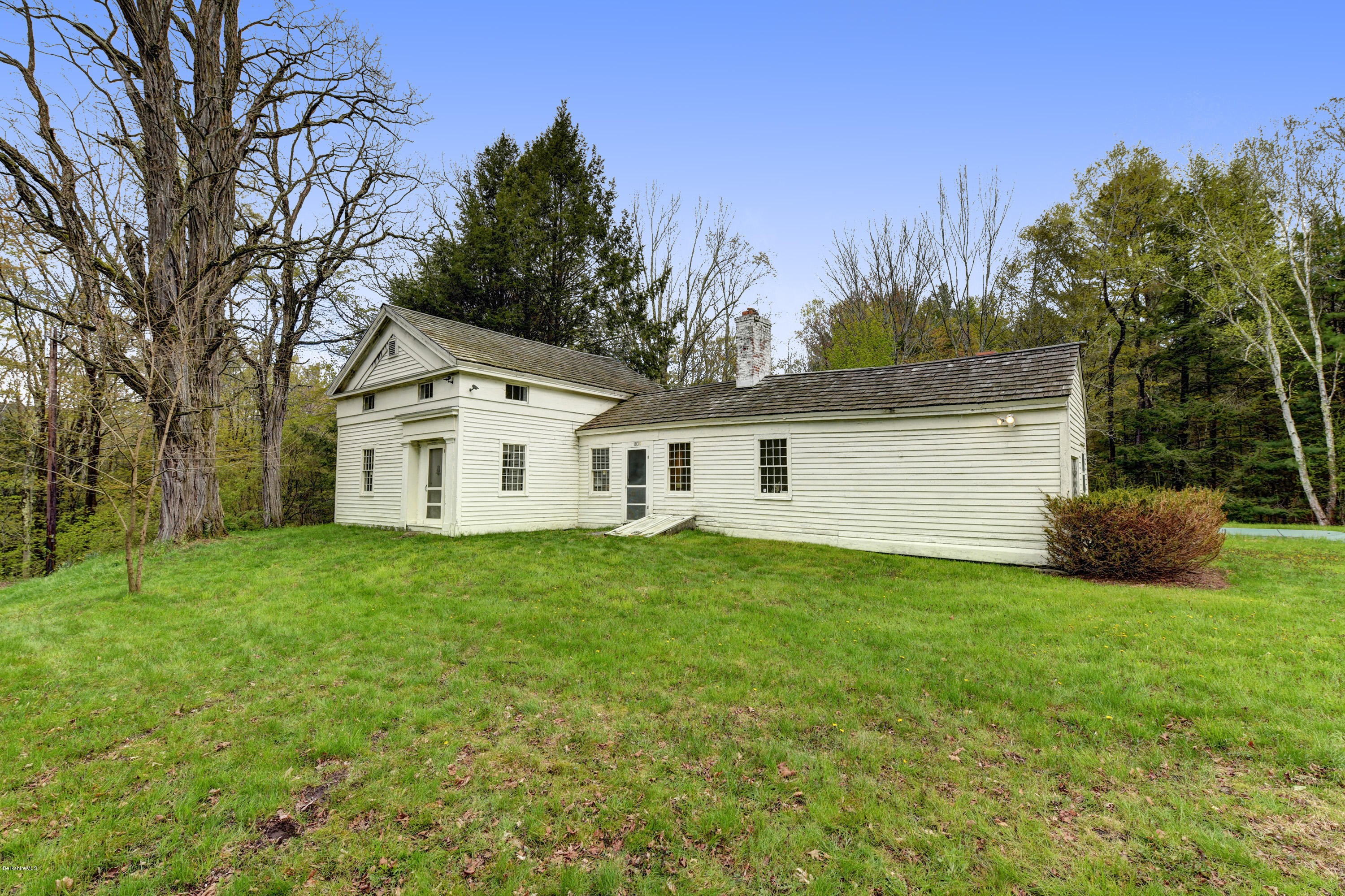 82 Hammertown Road Sandisfield, MA 01255 - Photo 2 of 49 a view of a yard in front of a house with large trees
