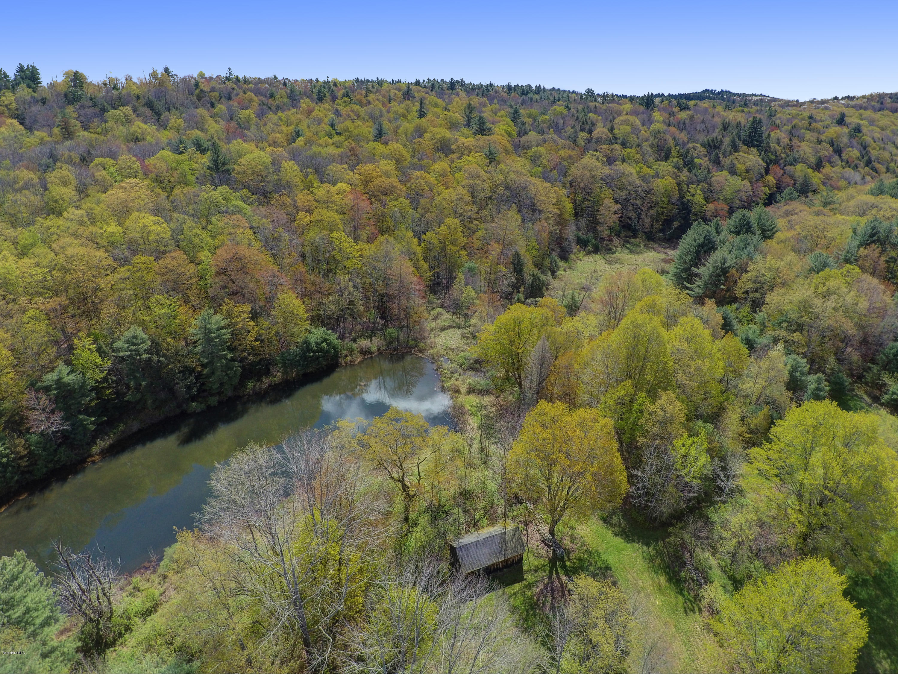82 Hammertown Road Sandisfield, MA 01255 - Photo 24 of 49 a view of a lake with mountains in the background