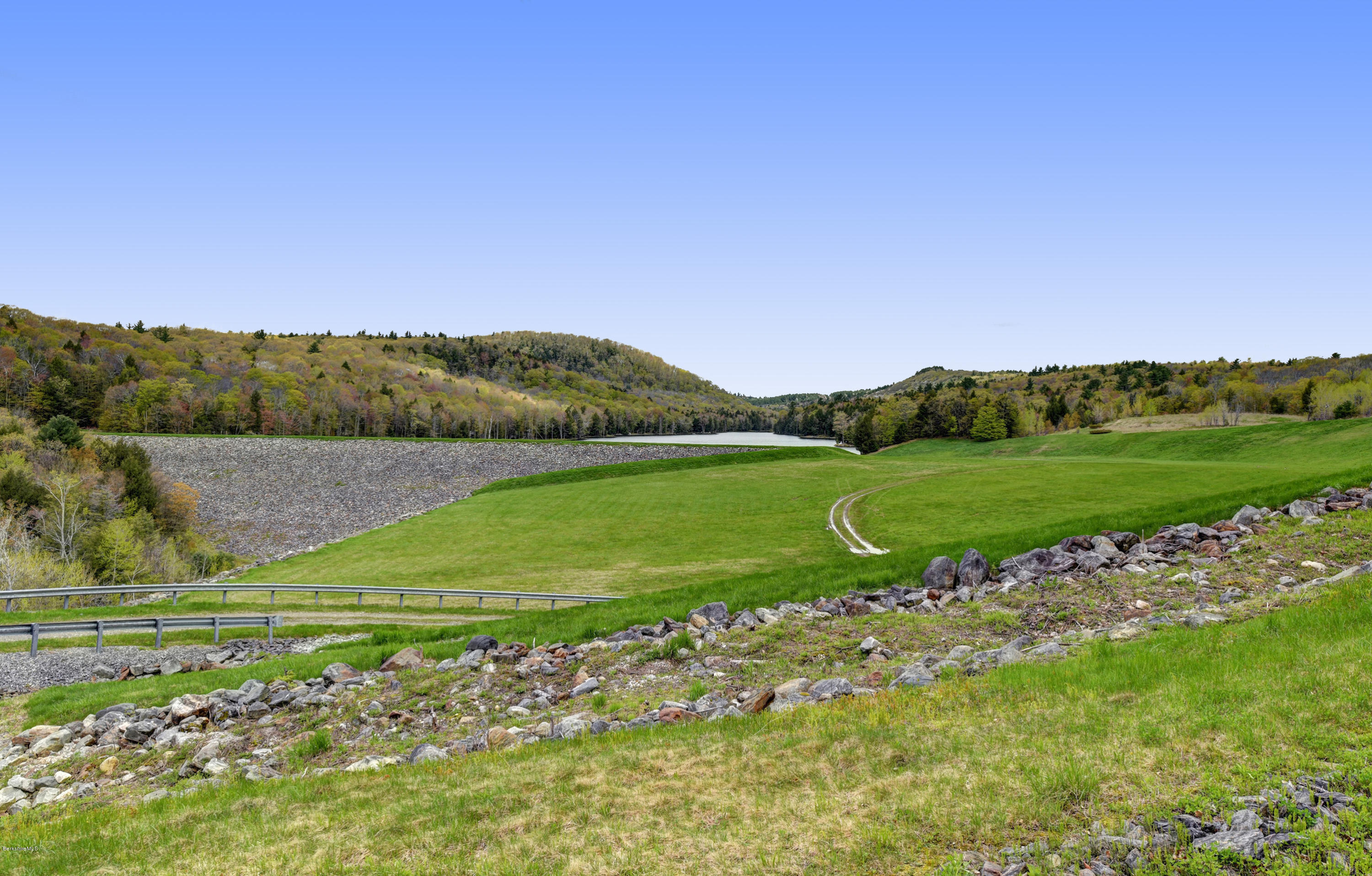 82 Hammertown Road Sandisfield, MA 01255 - Photo 27 of 49 a view of a golf course with a lake