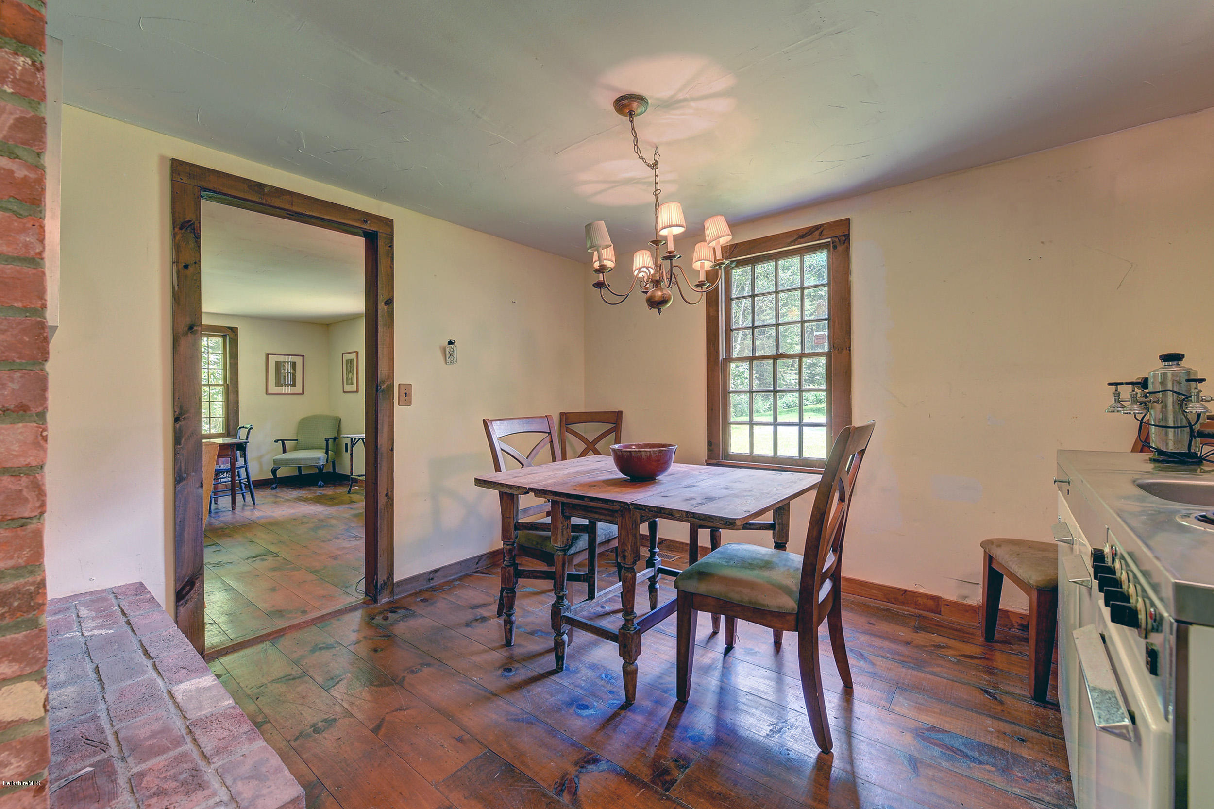 82 Hammertown Road Sandisfield, MA 01255 - Photo 36 of 49 a view of a dining room with furniture window and wooden floor