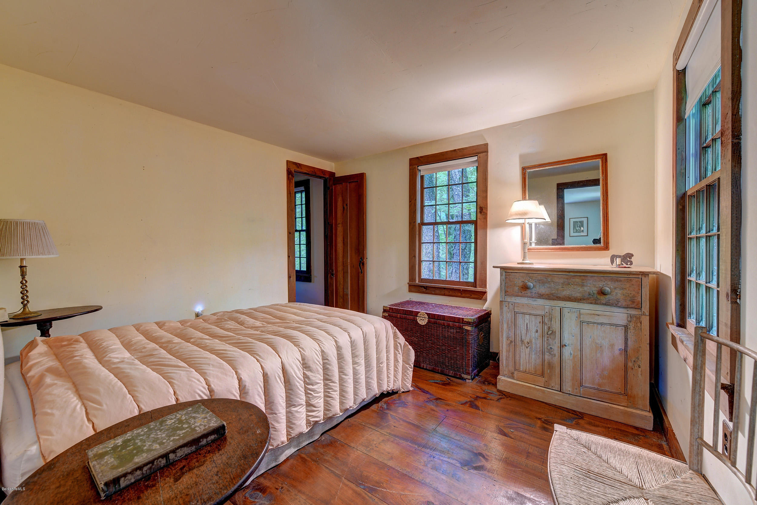 82 Hammertown Road Sandisfield, MA 01255 - Photo 40 of 49 a bedroom with a bed and a dresser next to a window