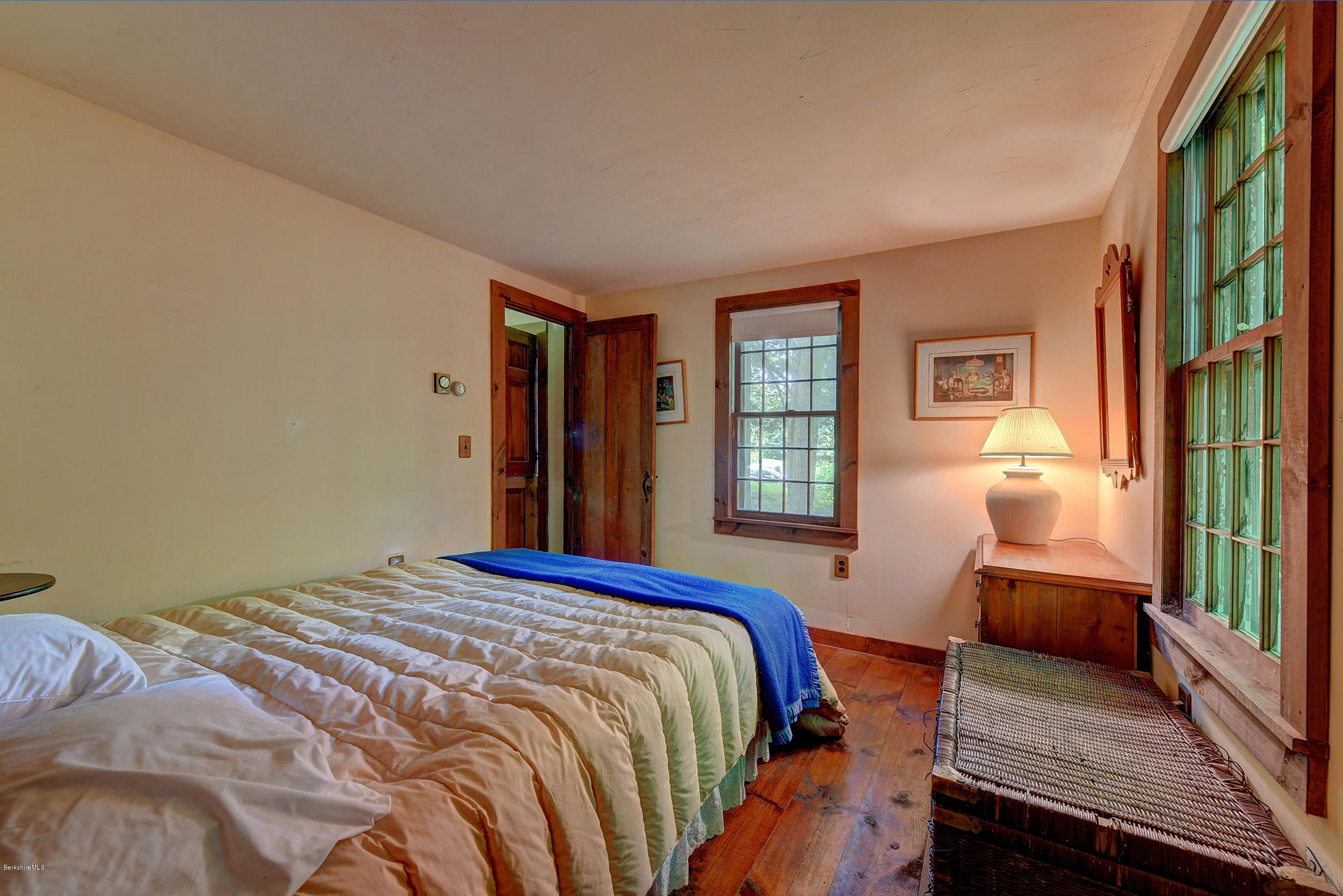 82 Hammertown Road Sandisfield, MA 01255 - Photo 43 of 49 a bedroom with a bed and wooden floor