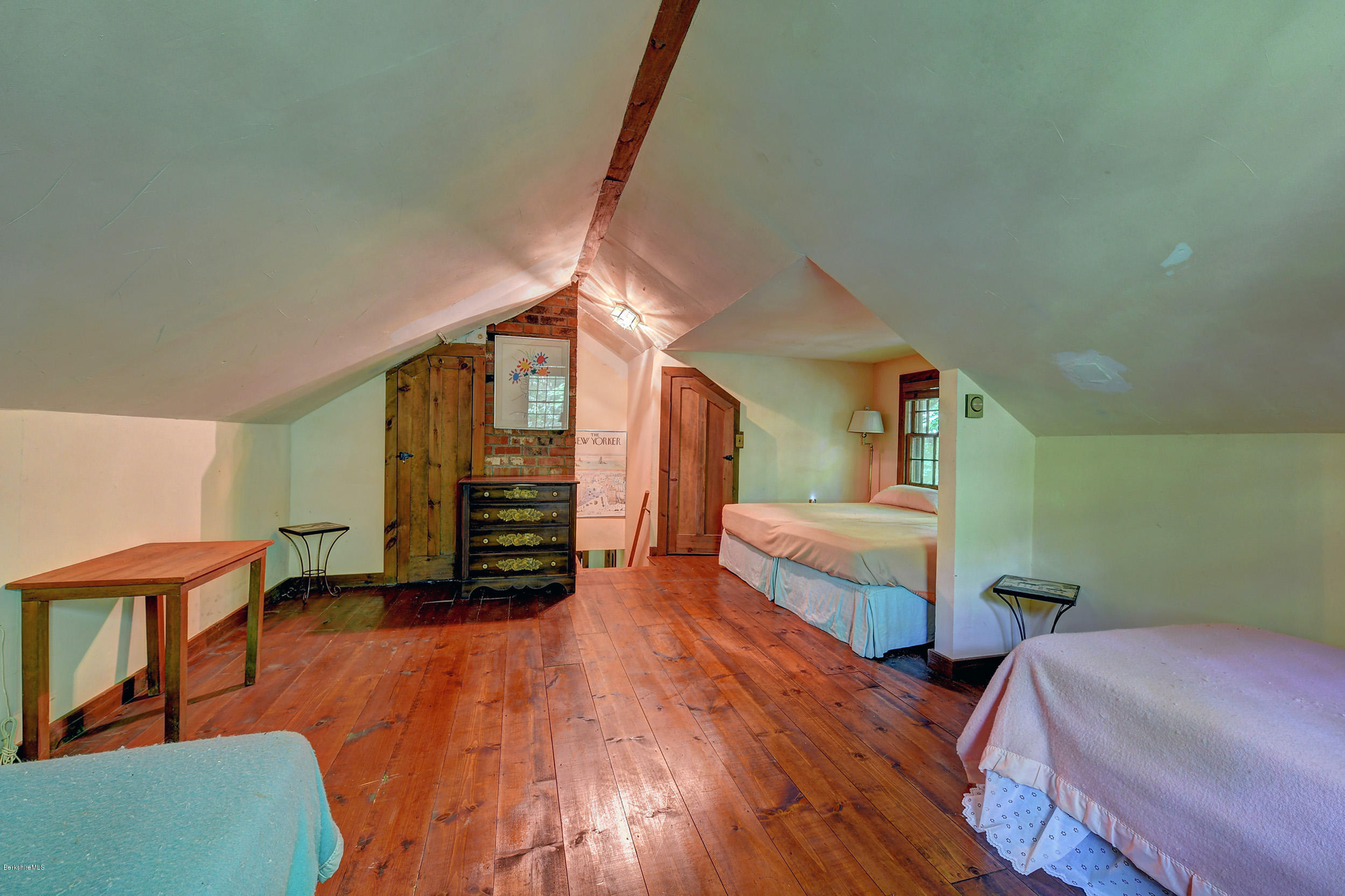 82 Hammertown Road Sandisfield, MA 01255 - Photo 46 of 49 a bedroom with furniture and a wooden floor