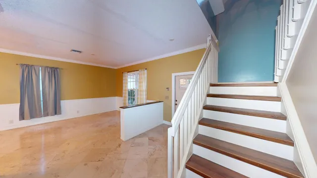 a view of entryway with wooden floor and door