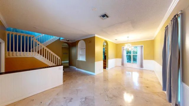 a view of a hallway with staircase