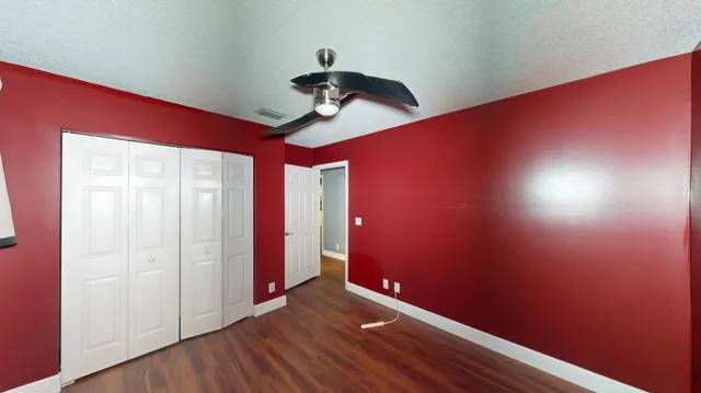 a view of room with a ceiling fan