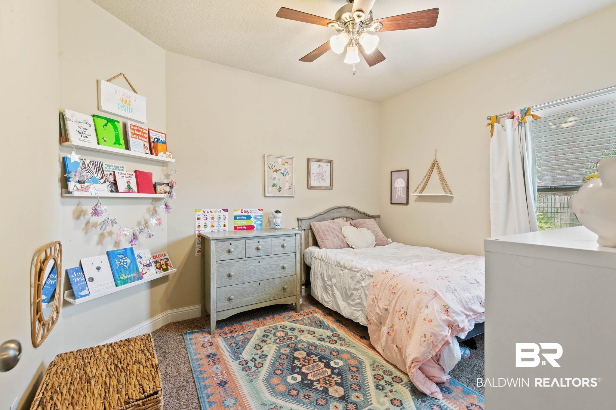 2216 Livingstone Court Mobile, AL 36695 - Photo 35 of 62 Neutral wall paint, ceiling fan with light fixture, built-in wall shelving, window with blinds, and carpeted flooring