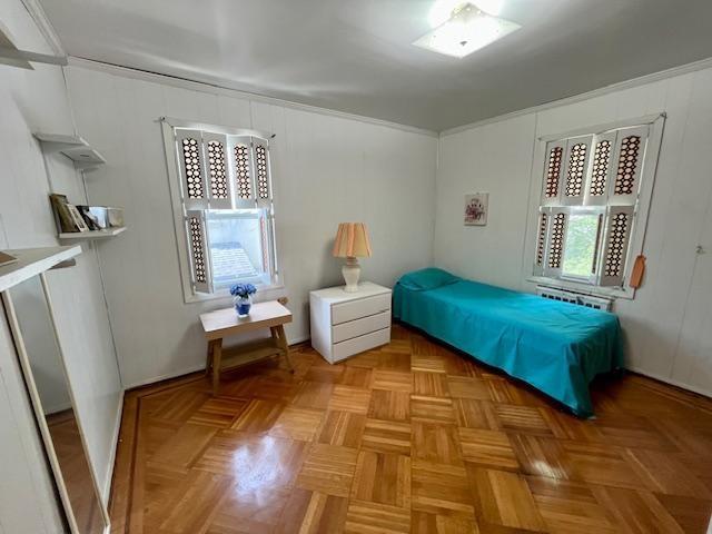 2955 Avenue P Brooklyn, NY 11229 - Photo 16 of 22 a bedroom with a bed and wooden floor