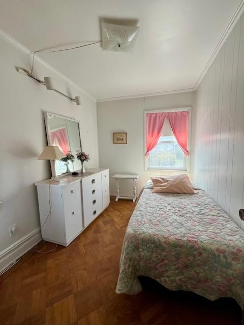 2955 Avenue P Brooklyn, NY 11229 - Photo 7 of 22 a bedroom with a bed and a chandelier