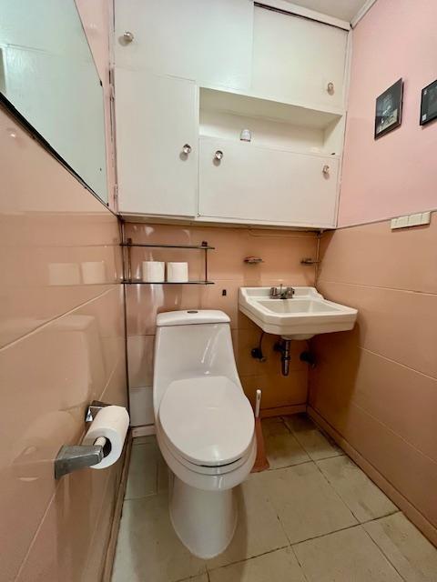 2955 Avenue P Brooklyn, NY 11229 - Photo 10 of 22 a bathroom with a toilet a sink and a mirror