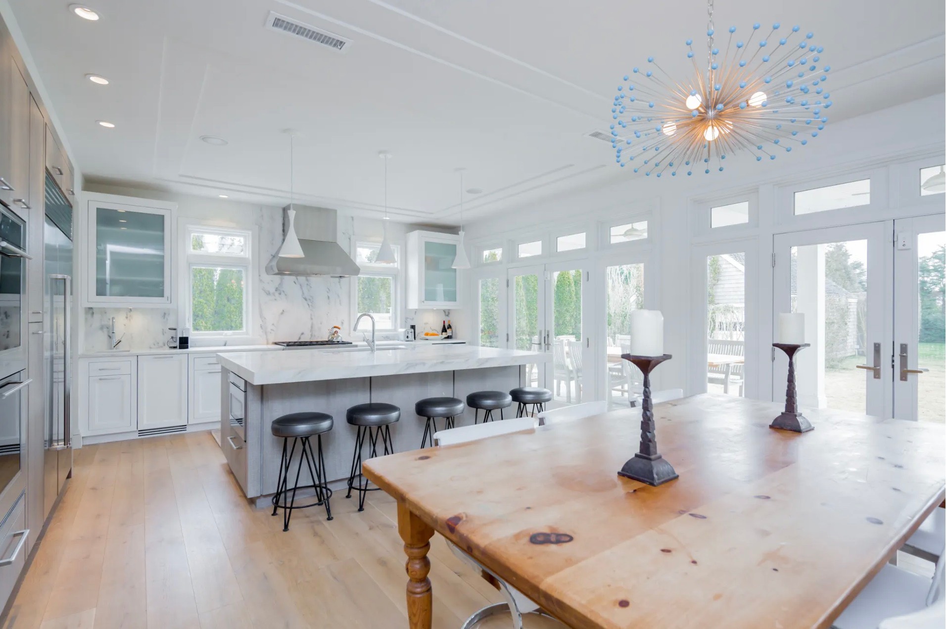 198 Herrick Road Southampton, NY 11968 - Photo 11 of 23 a large kitchen with a table and chairs