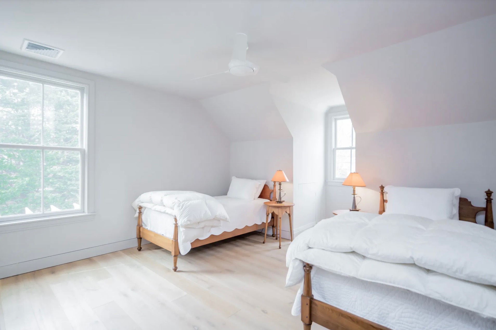 198 Herrick Road Southampton, NY 11968 - Photo 22 of 23 a spacious bedroom with two beds and a window
