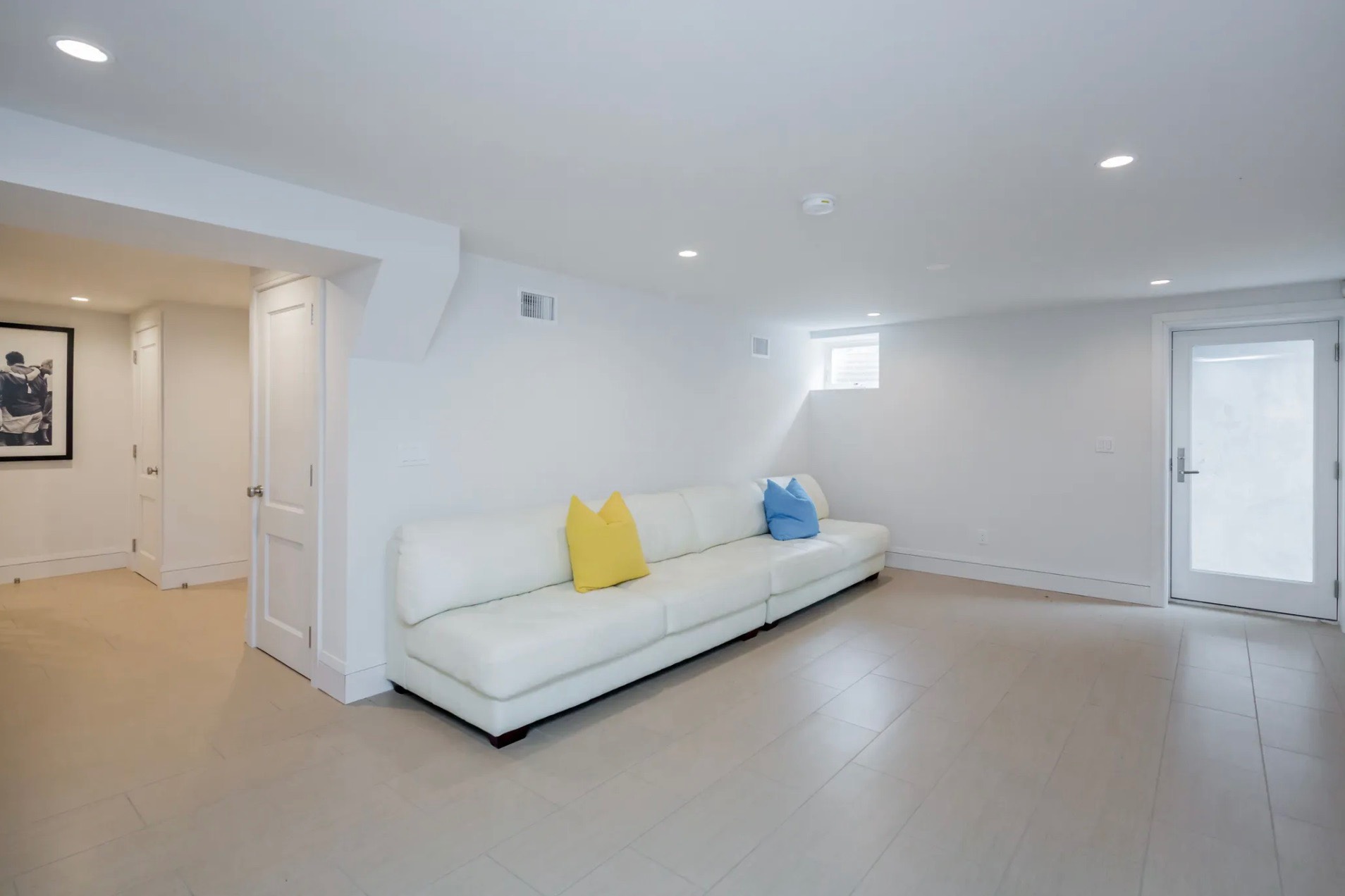 198 Herrick Road Southampton, NY 11968 - Photo 23 of 23 a living room with hard wood floors and a couch