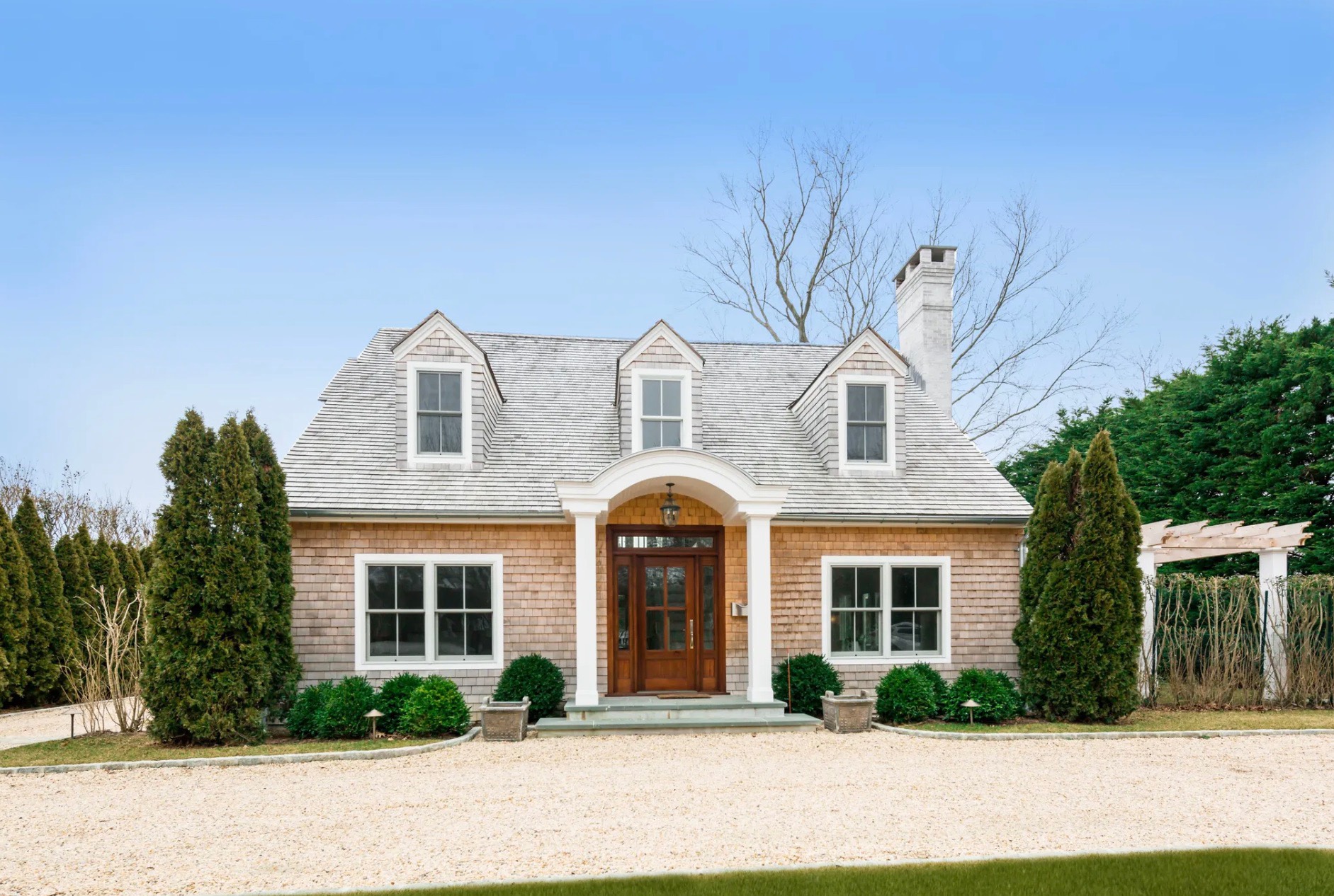 198 Herrick Road Southampton, NY 11968 - Photo 4 of 23 a front view of a house with garden