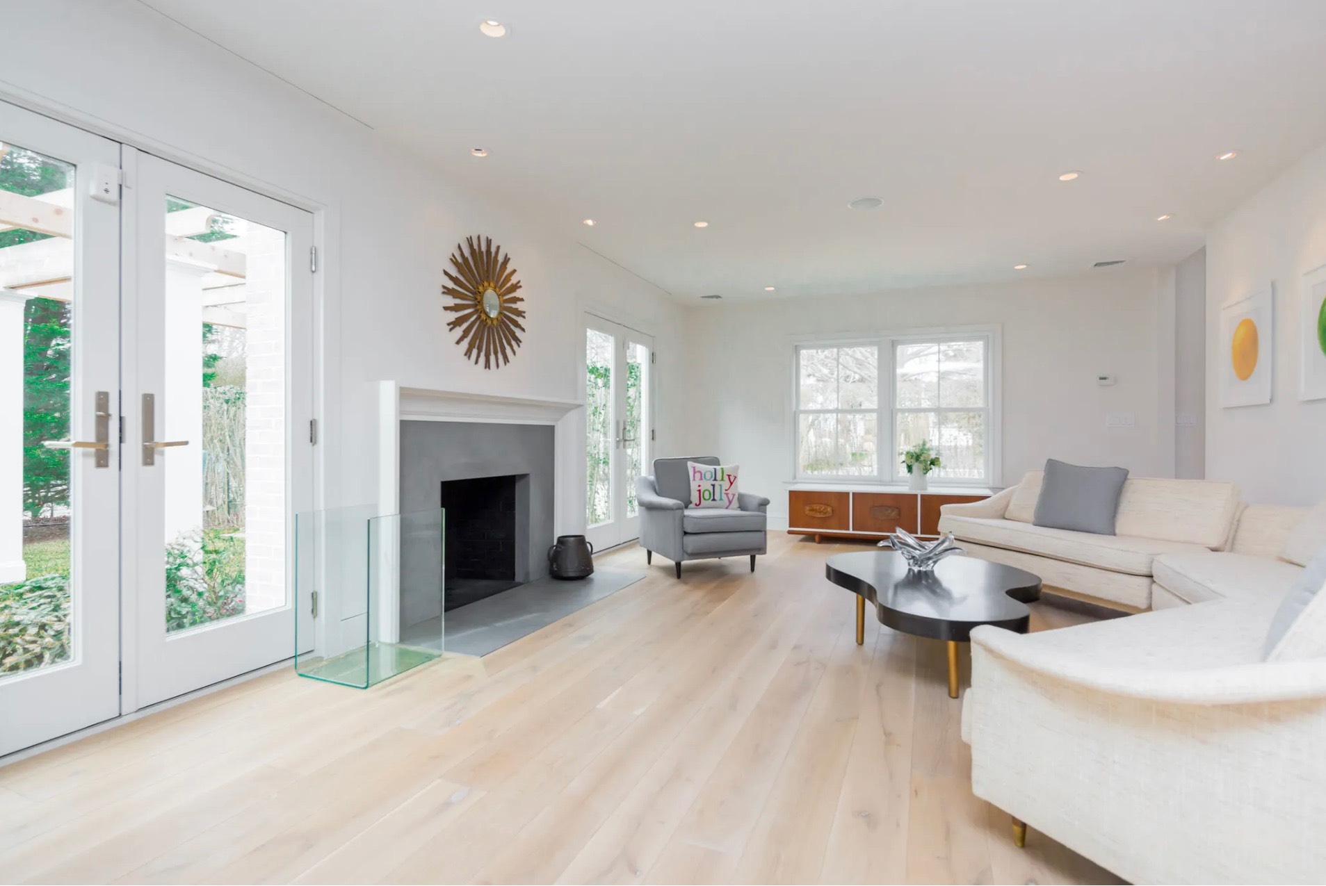 198 Herrick Road Southampton, NY 11968 - Photo 8 of 23 a living room with furniture large window and fireplace