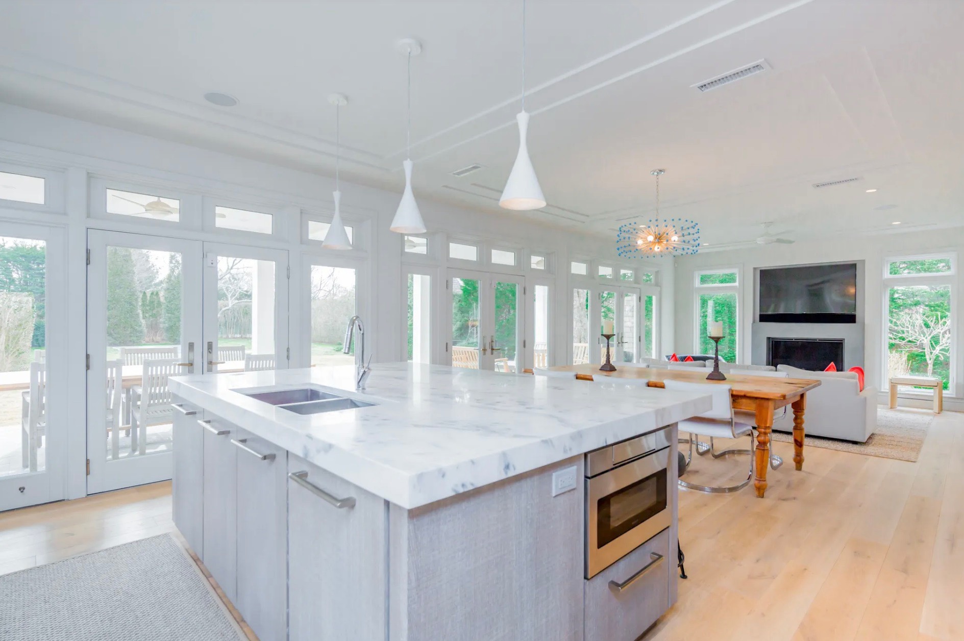 198 Herrick Road Southampton, NY 11968 - Photo 10 of 23 a dining hall with stainless steel appliances granite countertop a granite counter tops and a view of living room