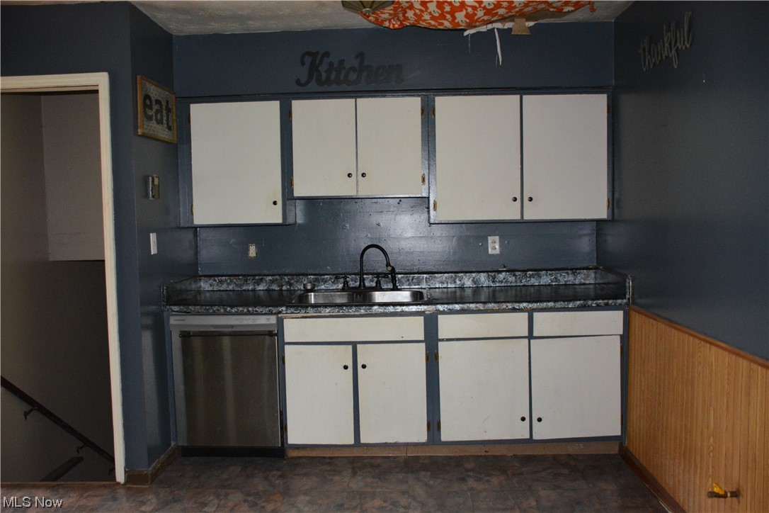 2791 Roberts Rdg Saint Joseph Road Moundsville, WV 26041 - Photo 10 of 24 Kitchen with sink, dishwasher, white cabinetry, and dark tile floors