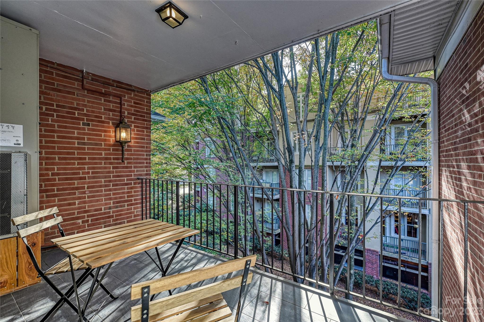 400 Queens Road, Unit B5 Charlotte, NC 28207 - Photo 1 of 20 a view of a balcony with chairs